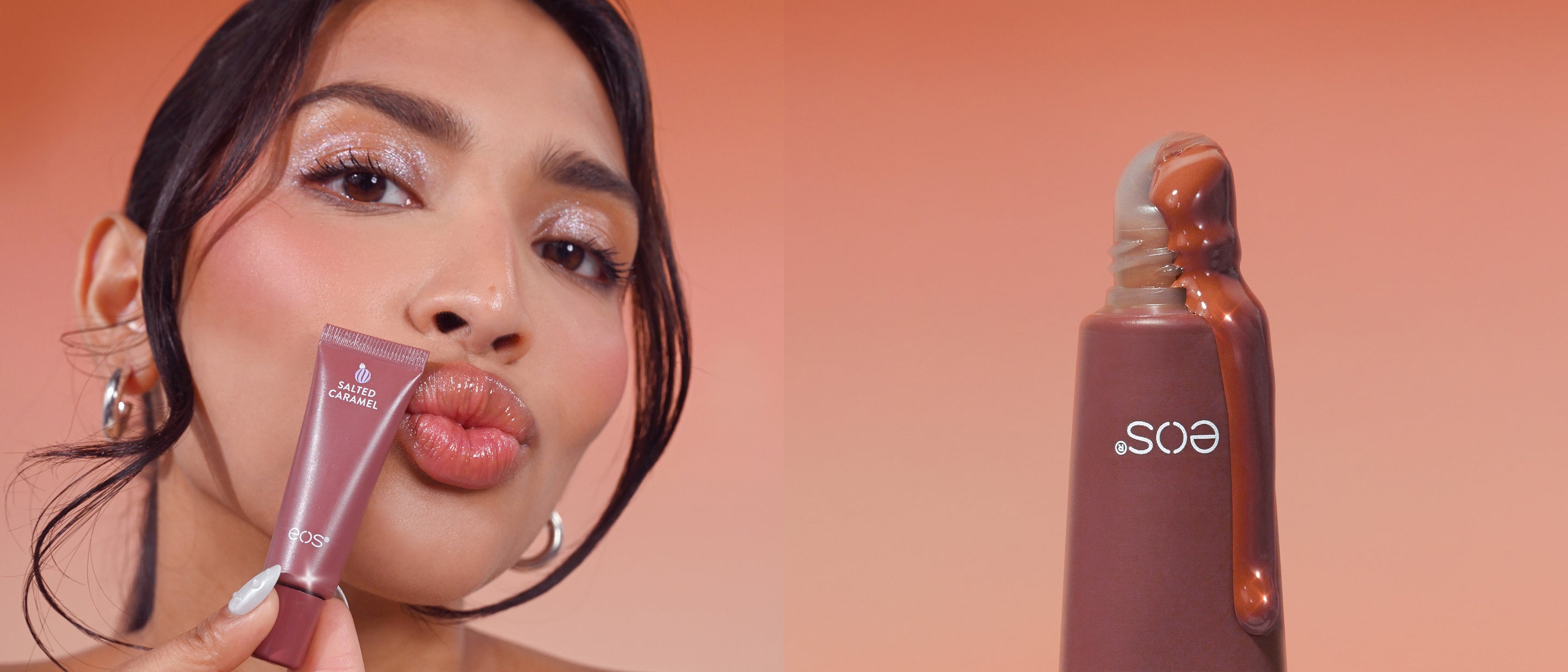 Woman applying makeup with a eos product on a peach background